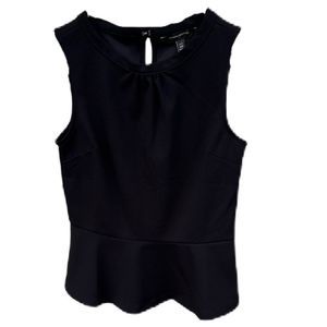 Banana Republic petite black sleeveless classy top with fluted bottom. Size XS